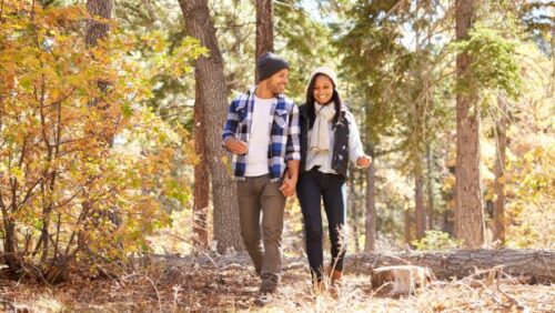 Couple walking in woods